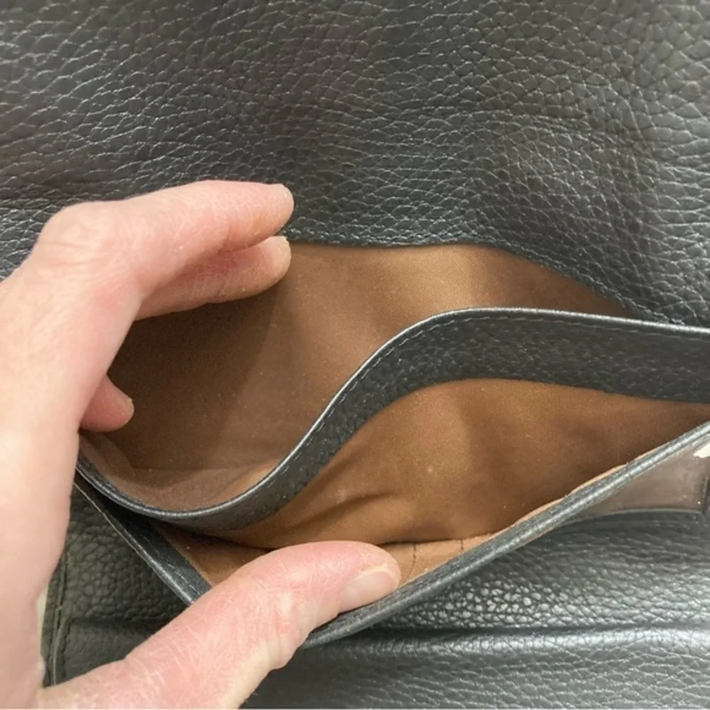 Dooney and Bourke rare perforated black pebbled leather 2 piece wallet set
